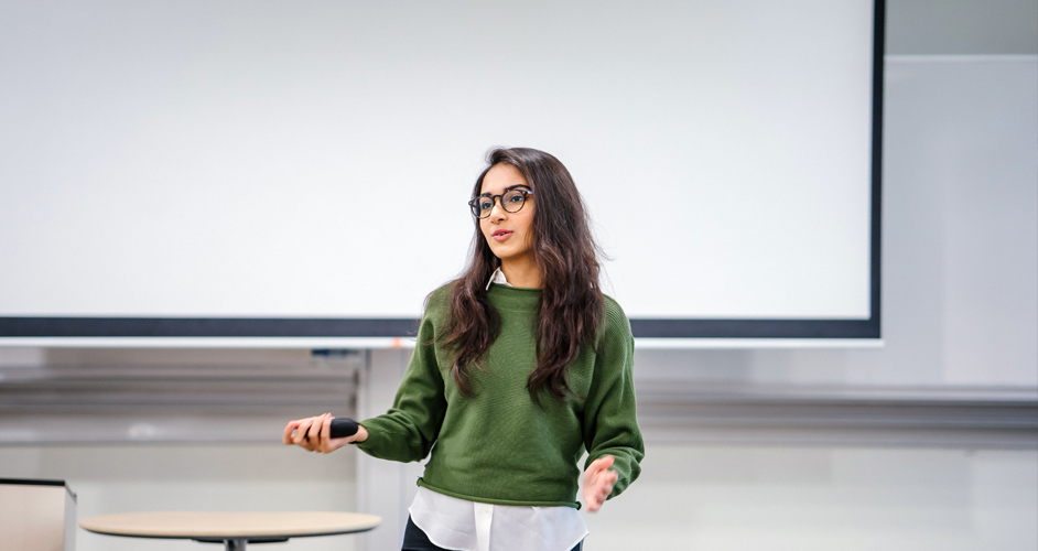 Image of a lady giving a business presentation.