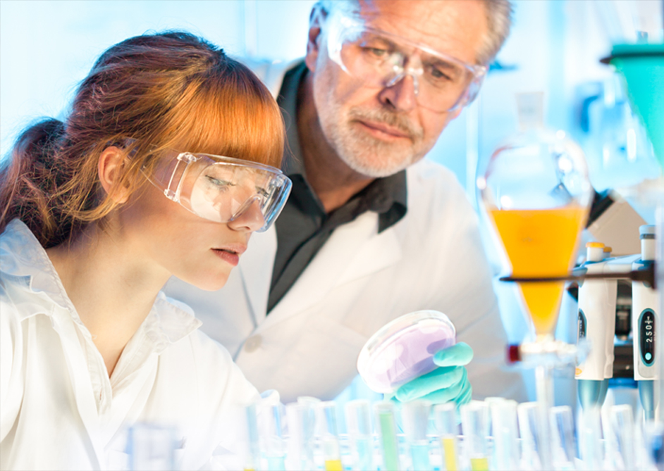 Image of a teacher and student in a science lab.